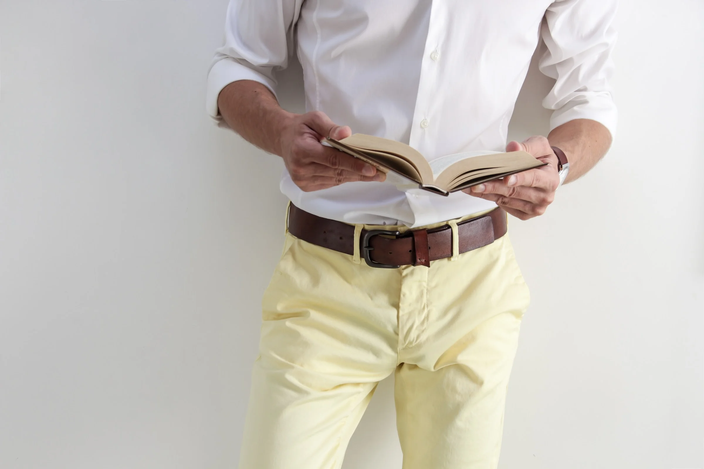 a man reading article about leather belt reviews