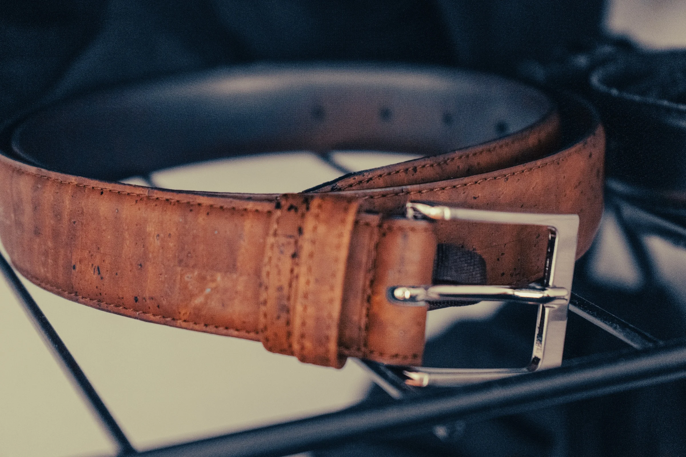 a leather belt on stand